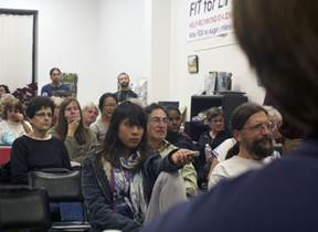 About 50 people attended, and nearly every chair in the small office was filled while the edges were scattered with observers. (Photo by: Stephen Hobbs)